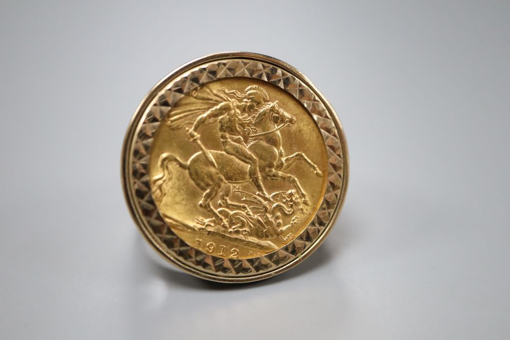 A George V 1912 gold sovereign, now in 9ct gold ring mount, size Q, gross 14.1 grams.